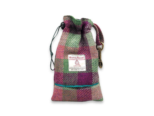 Plaid drawstring dog treat bag with a visible brand label on a white background