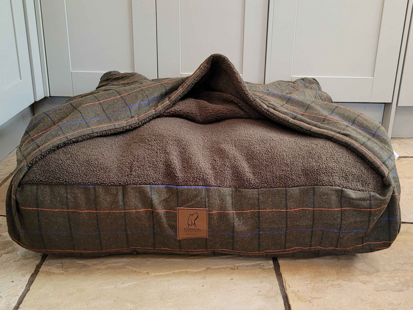 Front view of Collared Creatures Green Tweed Dog Snuggle Bed with open hood