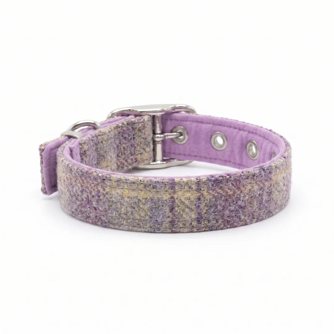 A lavender purple woven dog collar with a textured pattern of purple, pink, and beige threads, featuring silver-tone metal hardware and a matching purple fabric lining.