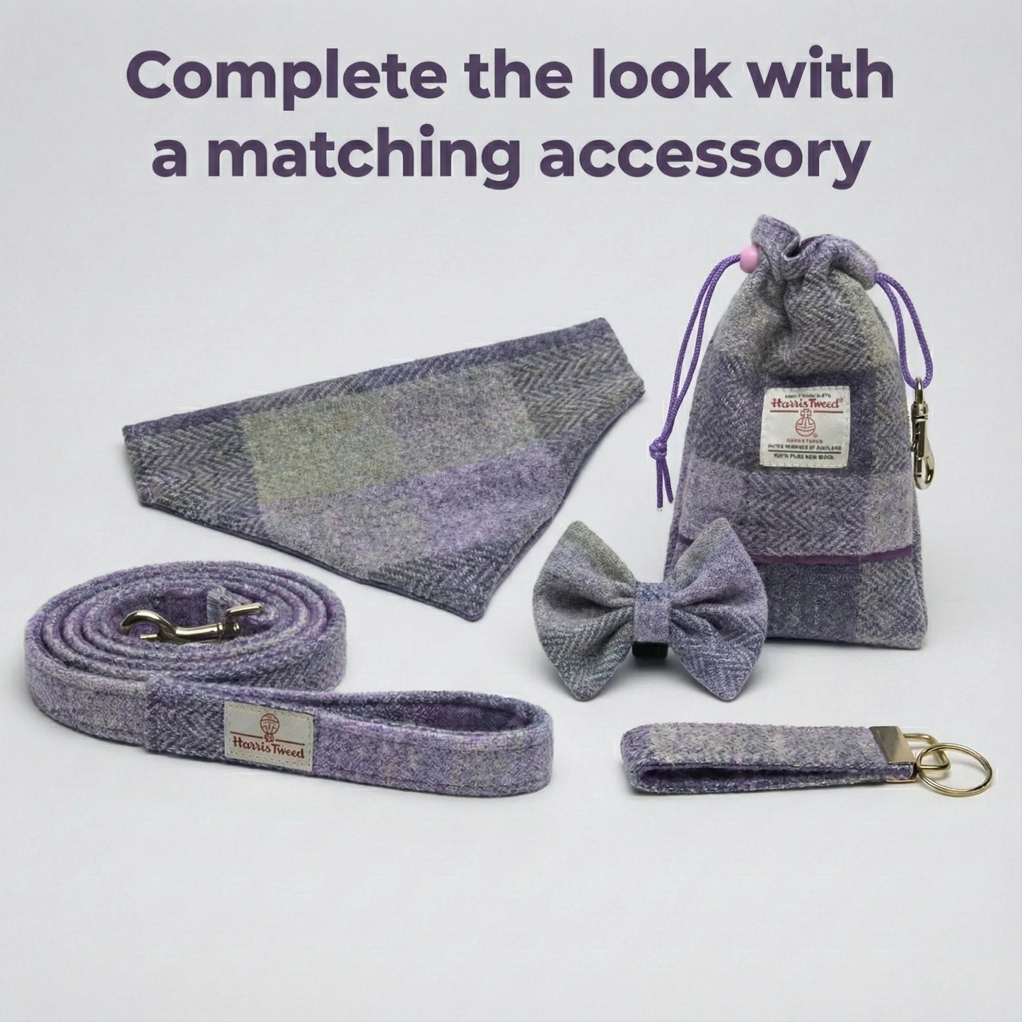 Dog accessory set including collar, bow tie, leash, and pouch on a light gray background.