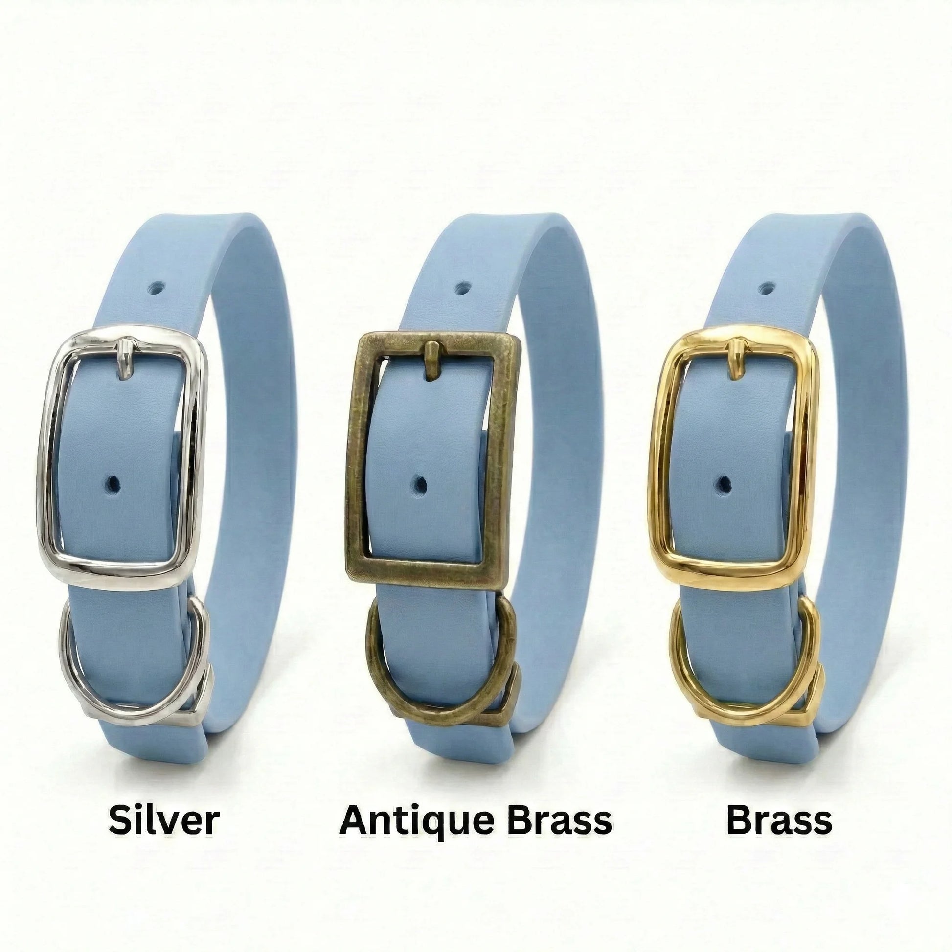Three light blue biothane dog collars with silver, antique brass, and brass buckles on a white background.