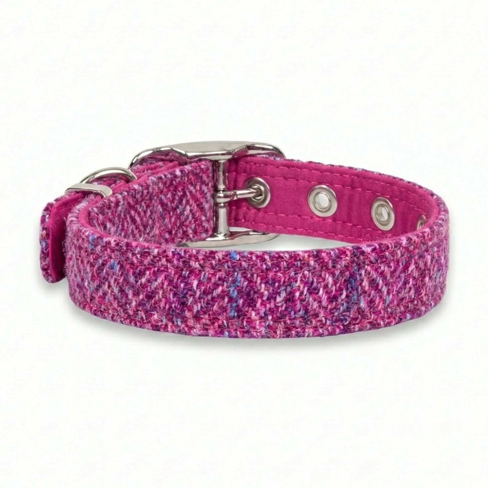 Pink harris tweed dog collar with silver buckle on a white background