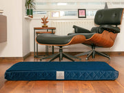 Sapphire blue velour dog mattress bed in stylish modern living room
