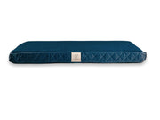 Side view of Collared Creatures sapphire blue dog mattress bed with quilted velour finish