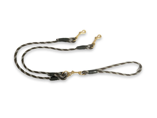 Dog leash with camouflage pattern and gold hardware on a white background