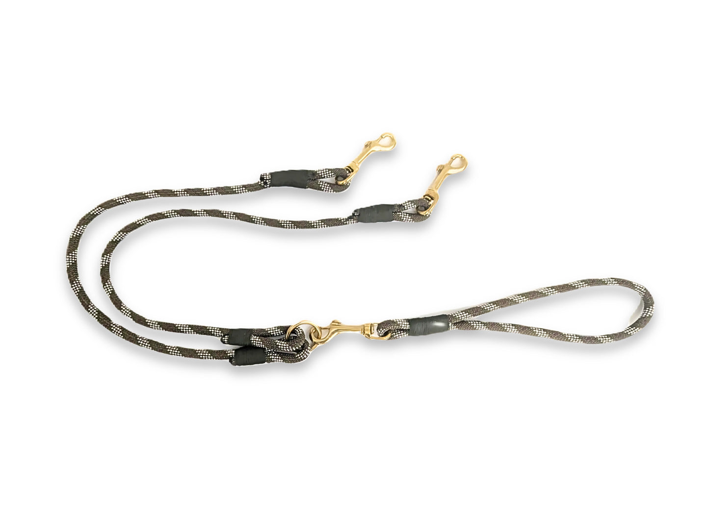 Dog leash with camouflage pattern and gold hardware on a white background