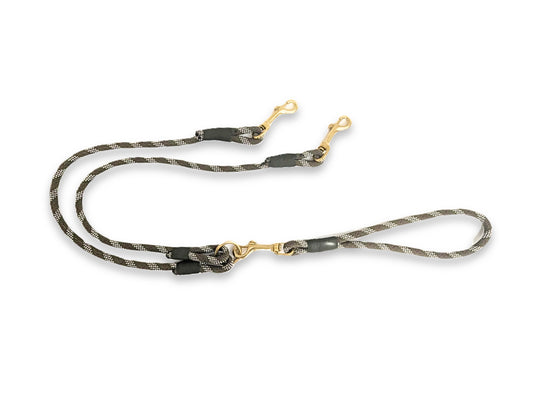 Dog leash with camouflage pattern and gold hardware on a white background