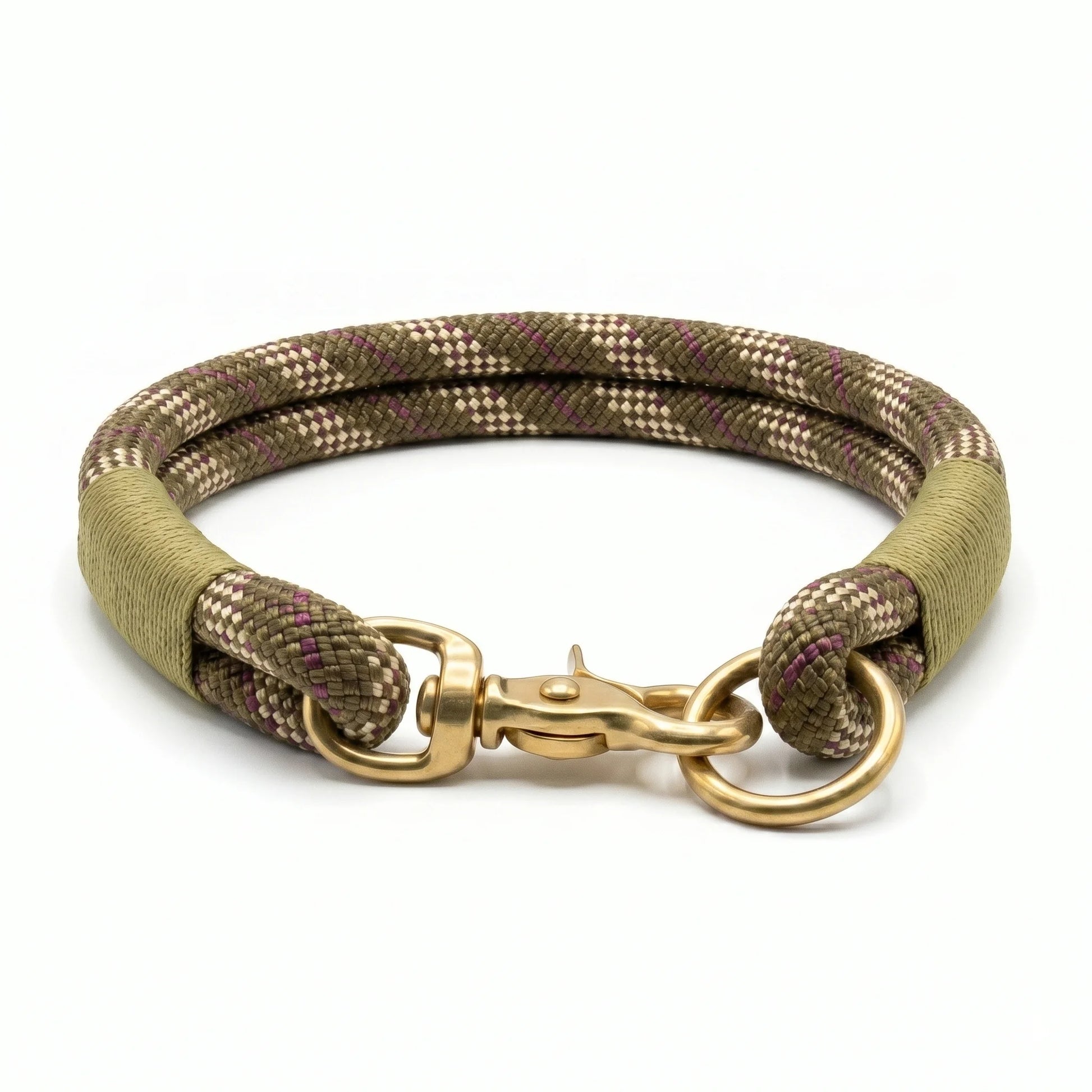 Dog collar made in rope with paracord whipping with gold clasp on a white background