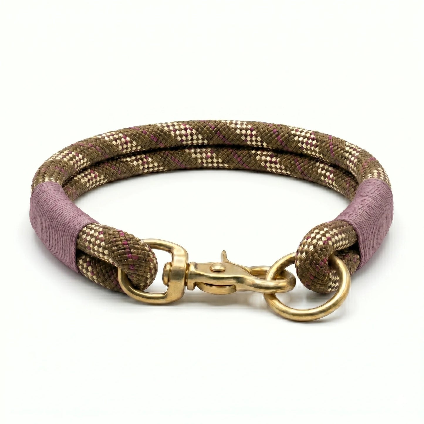 rope dog collar with gold clasp and purple and brown woven design on a white background
