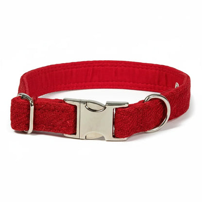 Simply red Harris Tweed dog collar with silver clasp on a white background