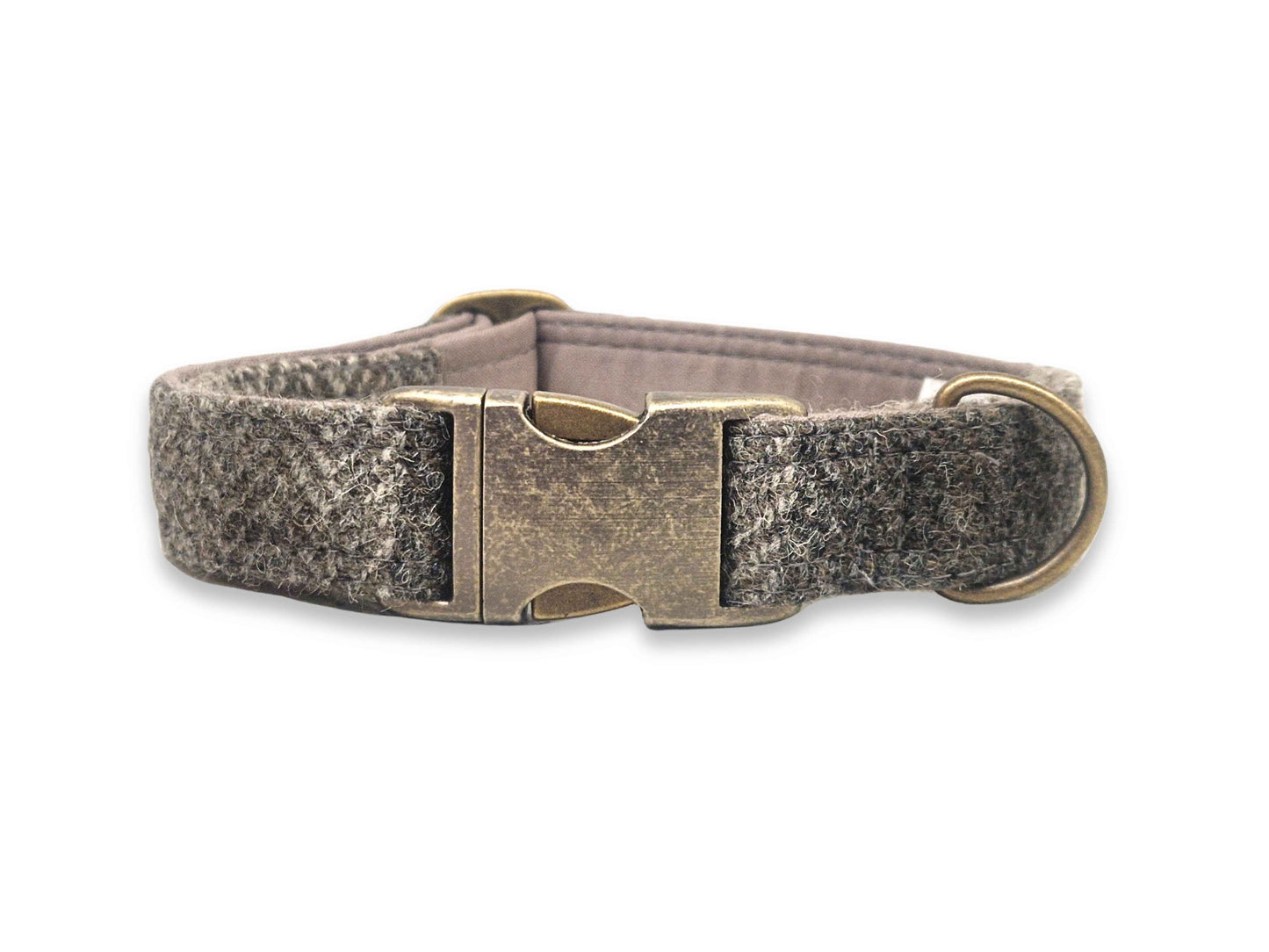 Dog collar with harris tweed fabric and brass buckle on a white background