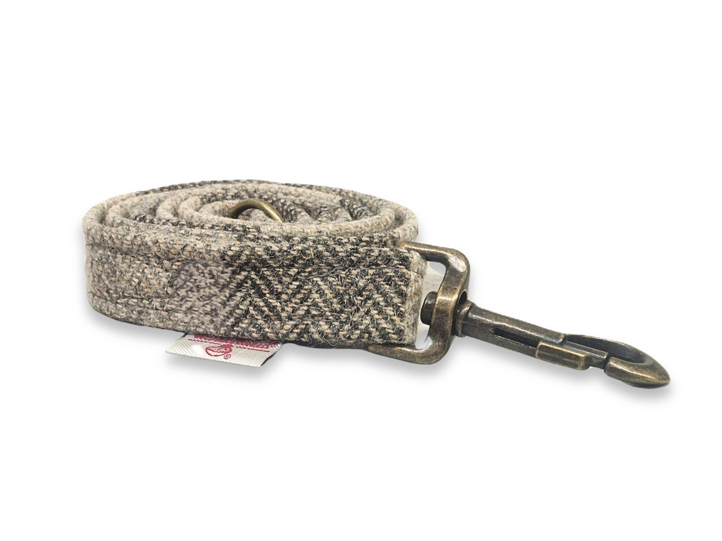Herringbone harris tweed dog leash with brass snap hook on a white background