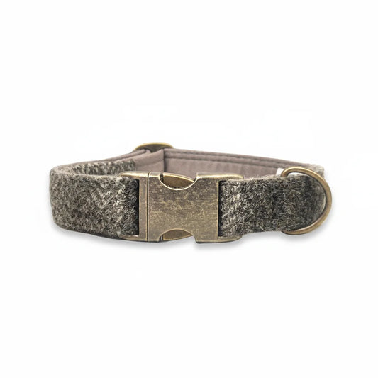 Stone check Harris Tweed dog collar with antique brass buckle on a white background