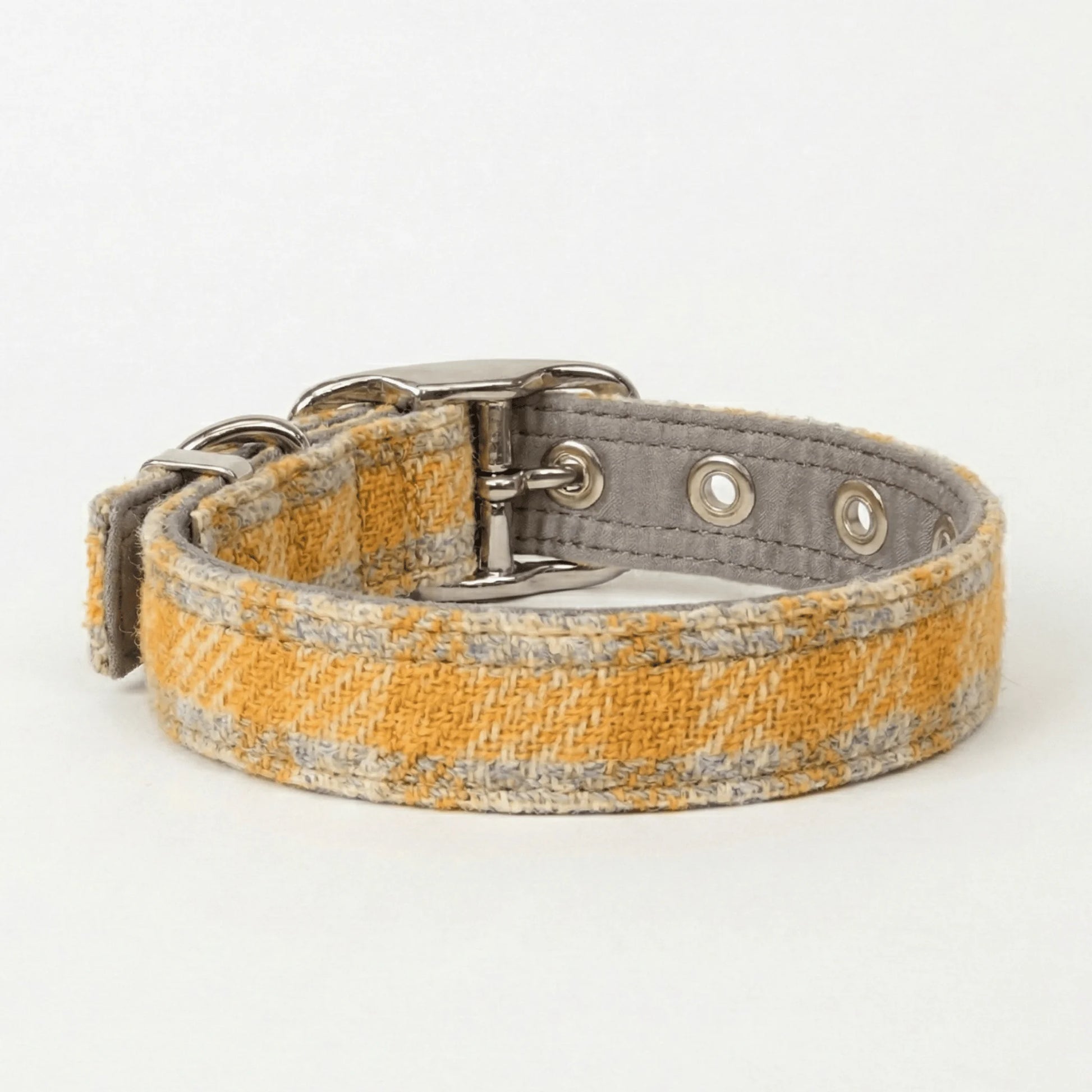 Dog collar with a yellow and gray pattern on a white background