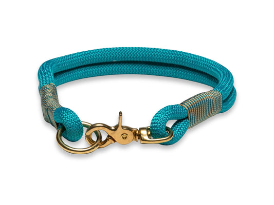 Teal handmade rope dog collar shown from the front with neat whipping and brass clasp