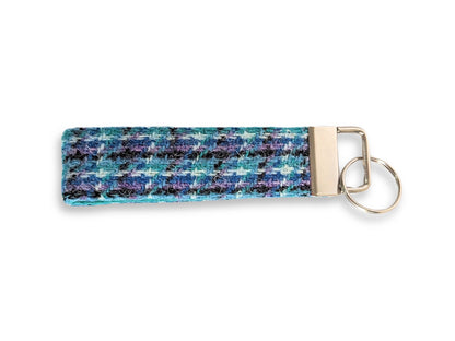 Teal, lilac, and black check Harris Tweed keyring with silver key fob