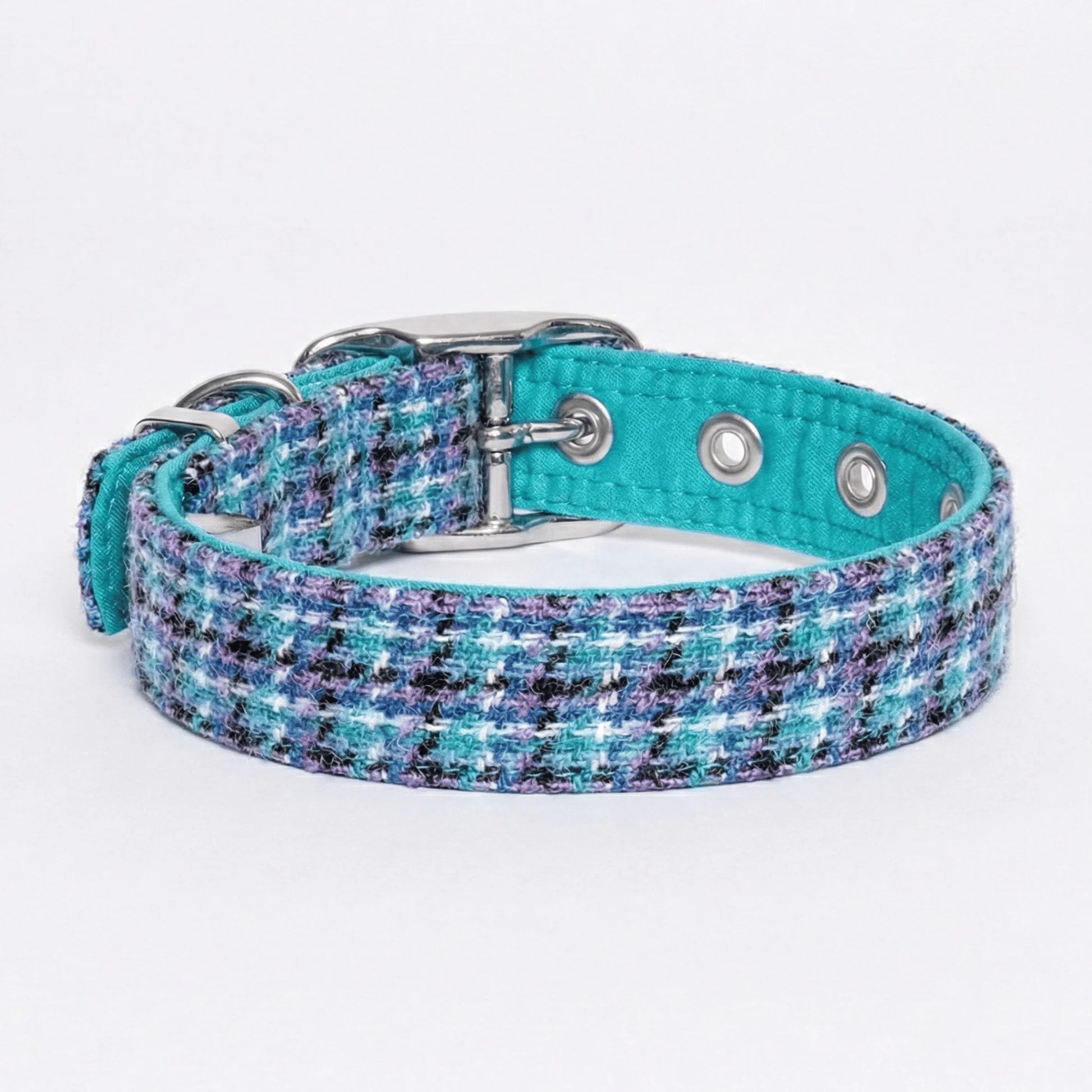 Teal and multicolored patterned tweed dog collar on a white background