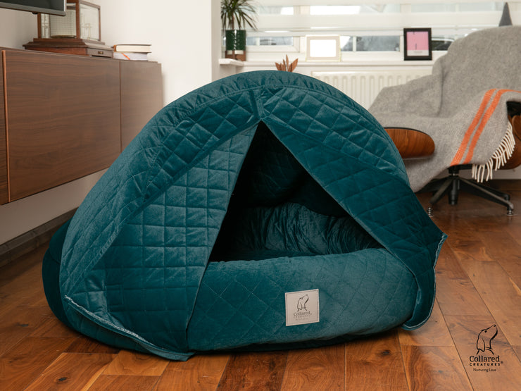 The luxury Collared Creatures Teal Quilted Velour Deluxe Comfort Cocoon Dog Cave Bed