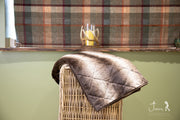 collared Creatures Luxury Dog Blanket -Sofa Throw In Brown Faux Fur displayed on wicker basket