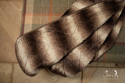 collared Creatures Luxury Dog Blanket -Sofa Throw In Brown Faux Fur displayed on green check foot stool