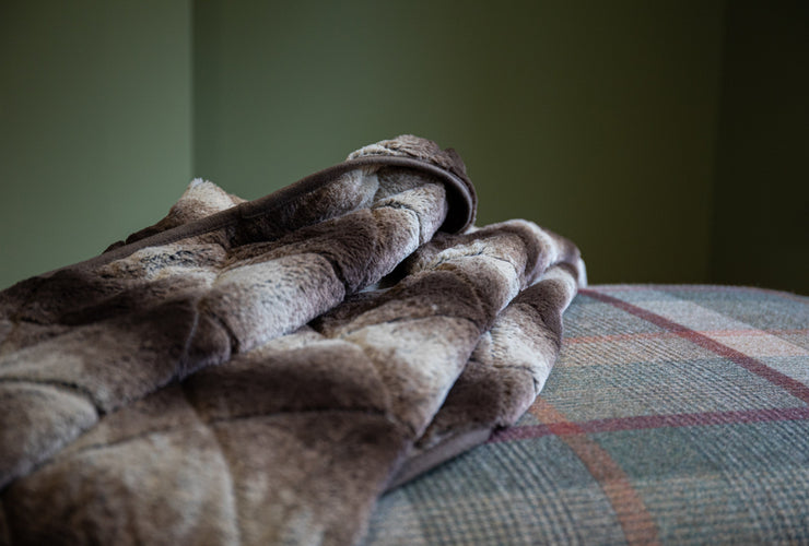 collared Creatures Luxury Dog Blanket -Sofa Throw In Brown Faux Fur displayed on green check foot stool